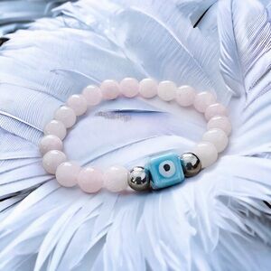 DANAI EYE BRACELET featuring genuine pink jade stones & stainless steel spacers